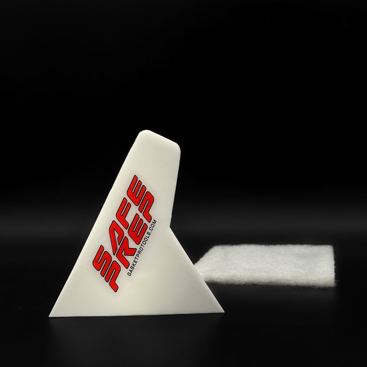 Safe Prep Scraper tool for window tinting, shown on a black background, with ergonomic design and included scrub pad.