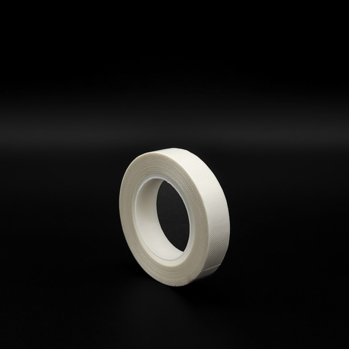 side view of the roll White Teflon Slip Tape roll for window tinting tools, 1/2-inch width, 33 feet length.