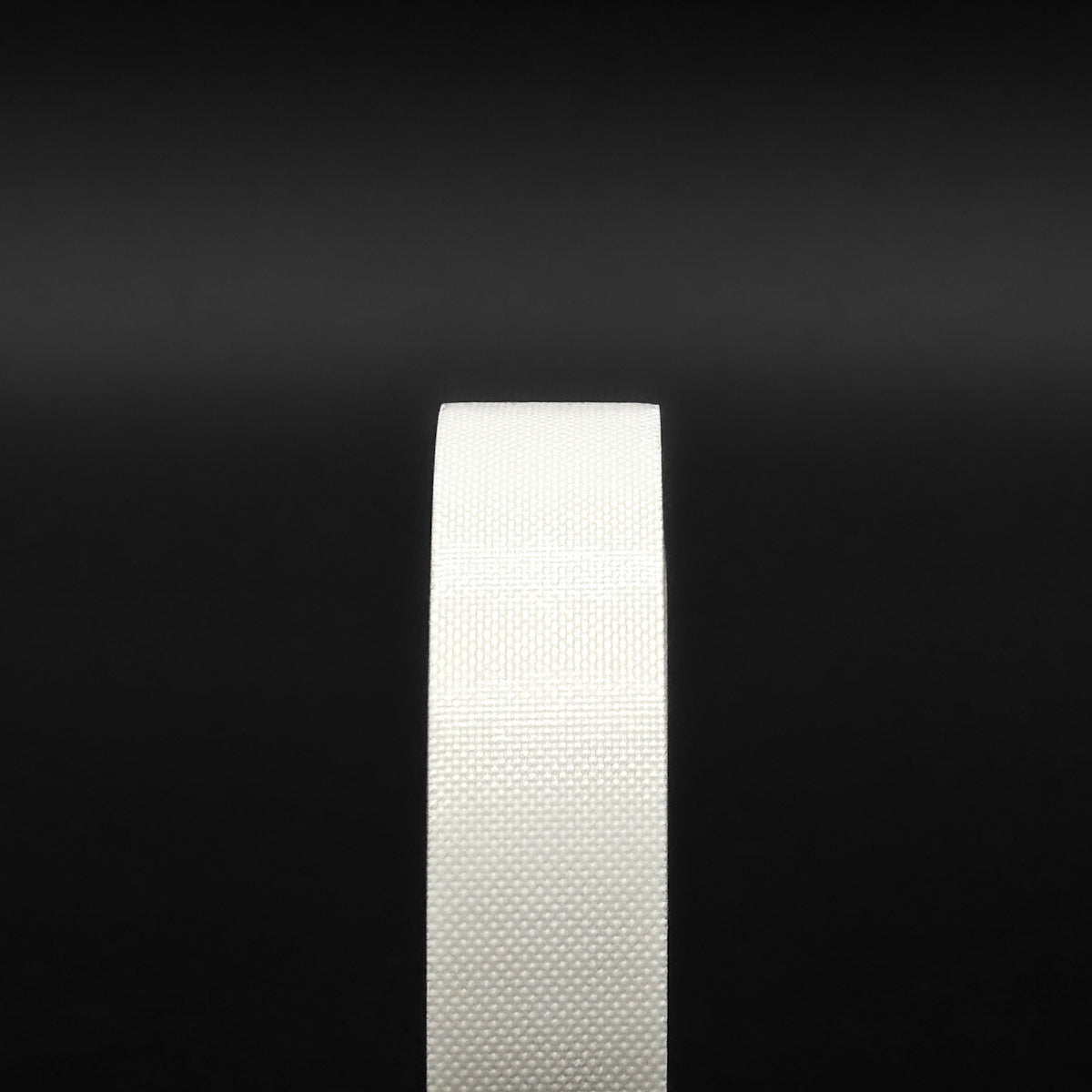 Close-up of smooth, residue-free White Teflon Slip Tape surface for scratch-free window tint installation.